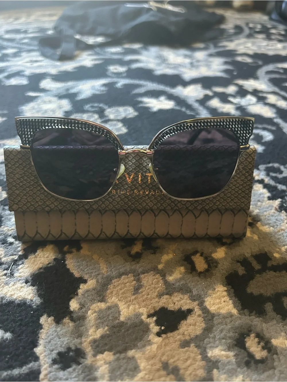Gold Metal Frame Sunglasses, hatched dark lenses.